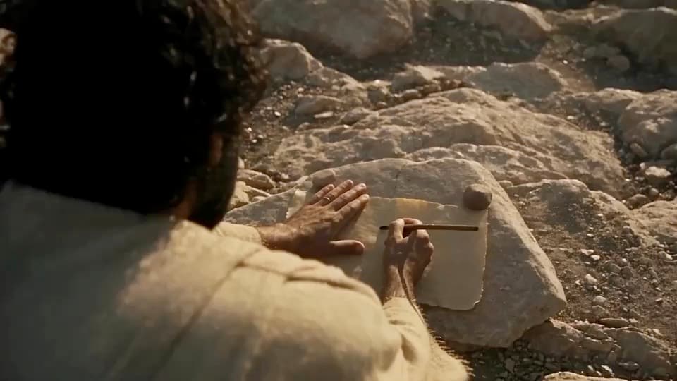 Character writing on Patmos in a cinematic landscape