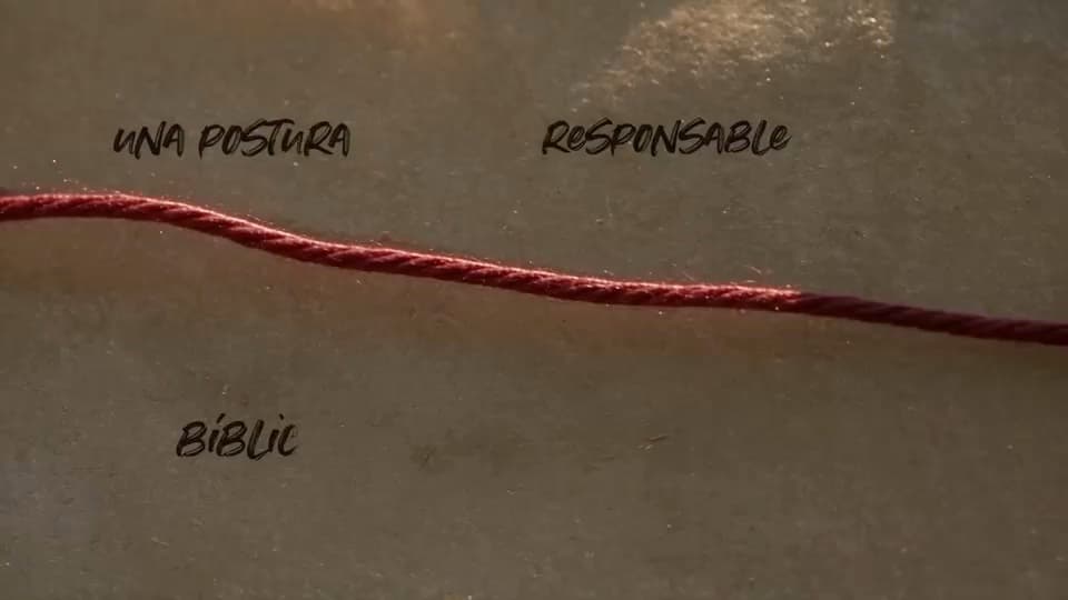 Red thread connecting words across a textured paper surface