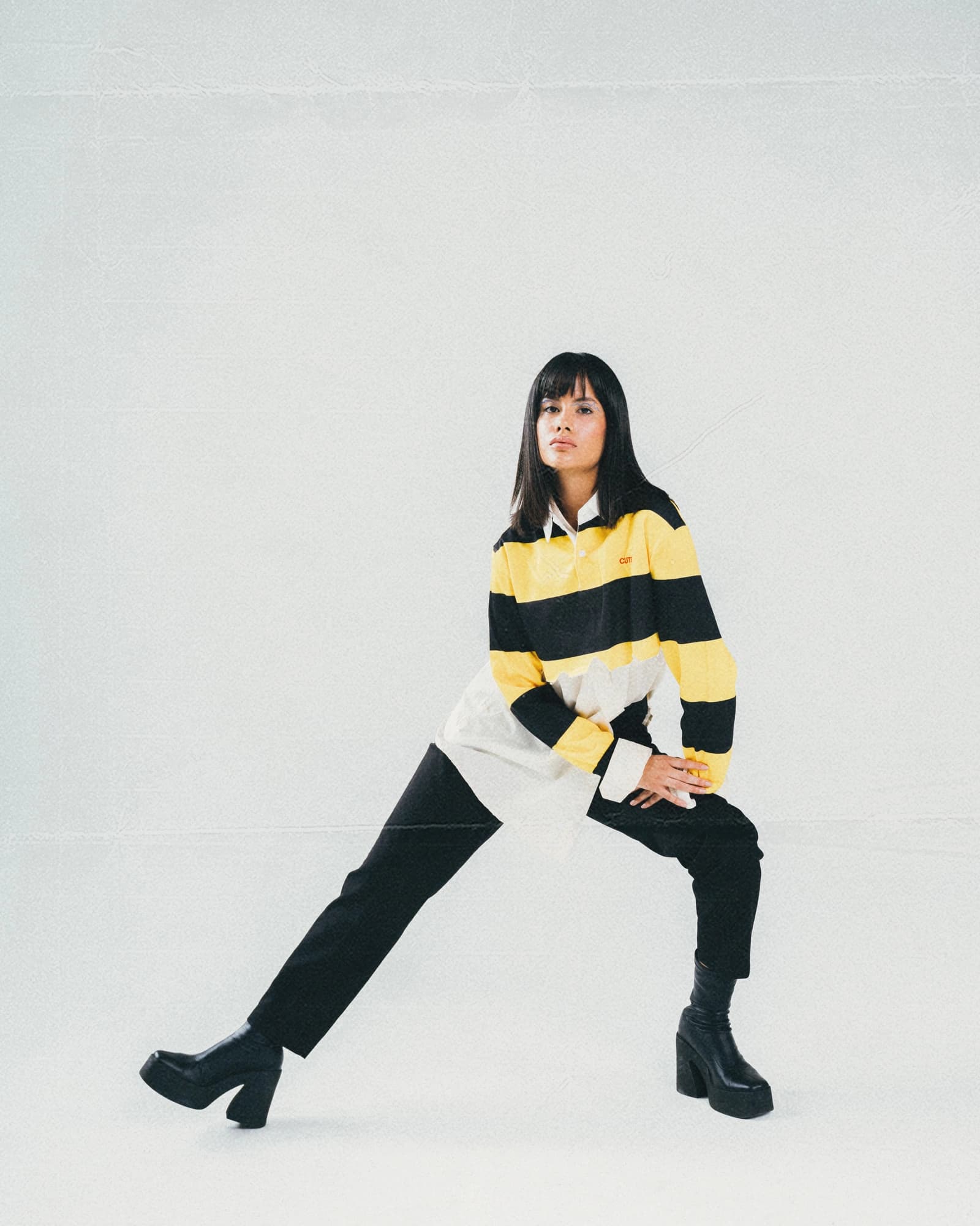 Wild Clearness editorial showing a full-body pose in yellow and black, photographed by Samuel Martínez