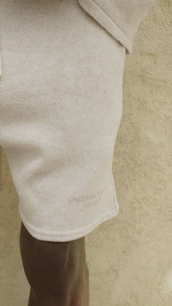 Close fashion-film view of an Under Gold loungewear garment